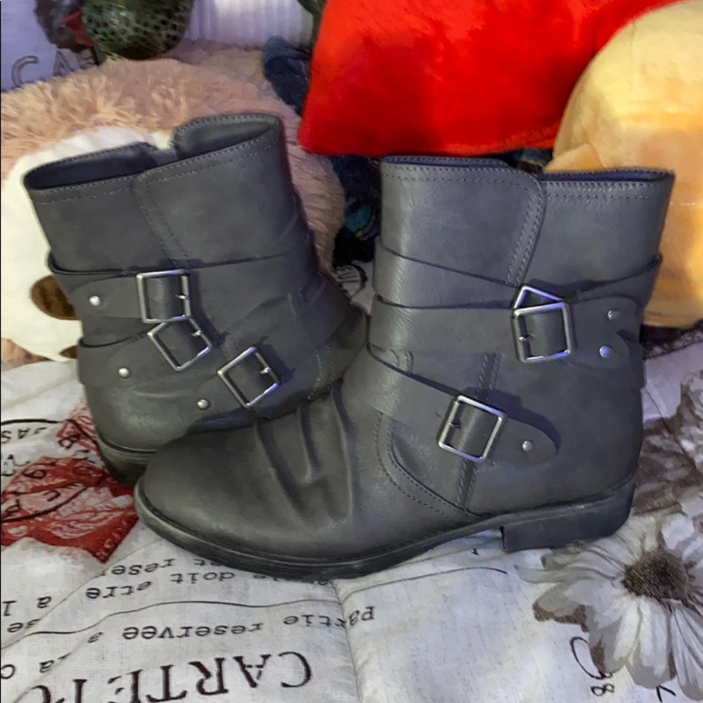Grey boots with a buckle on the side